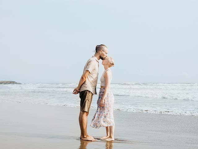 Romantic pre-wedding photoshoot on the sandy shores of Morjim Beach in Goa.